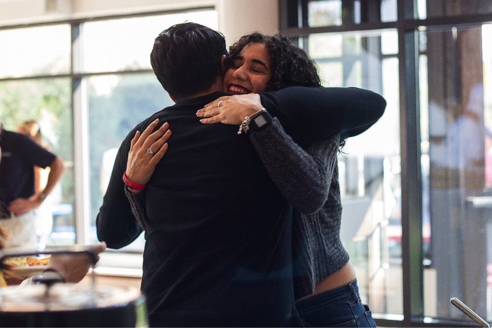 Two Latinx Center Students Hugging