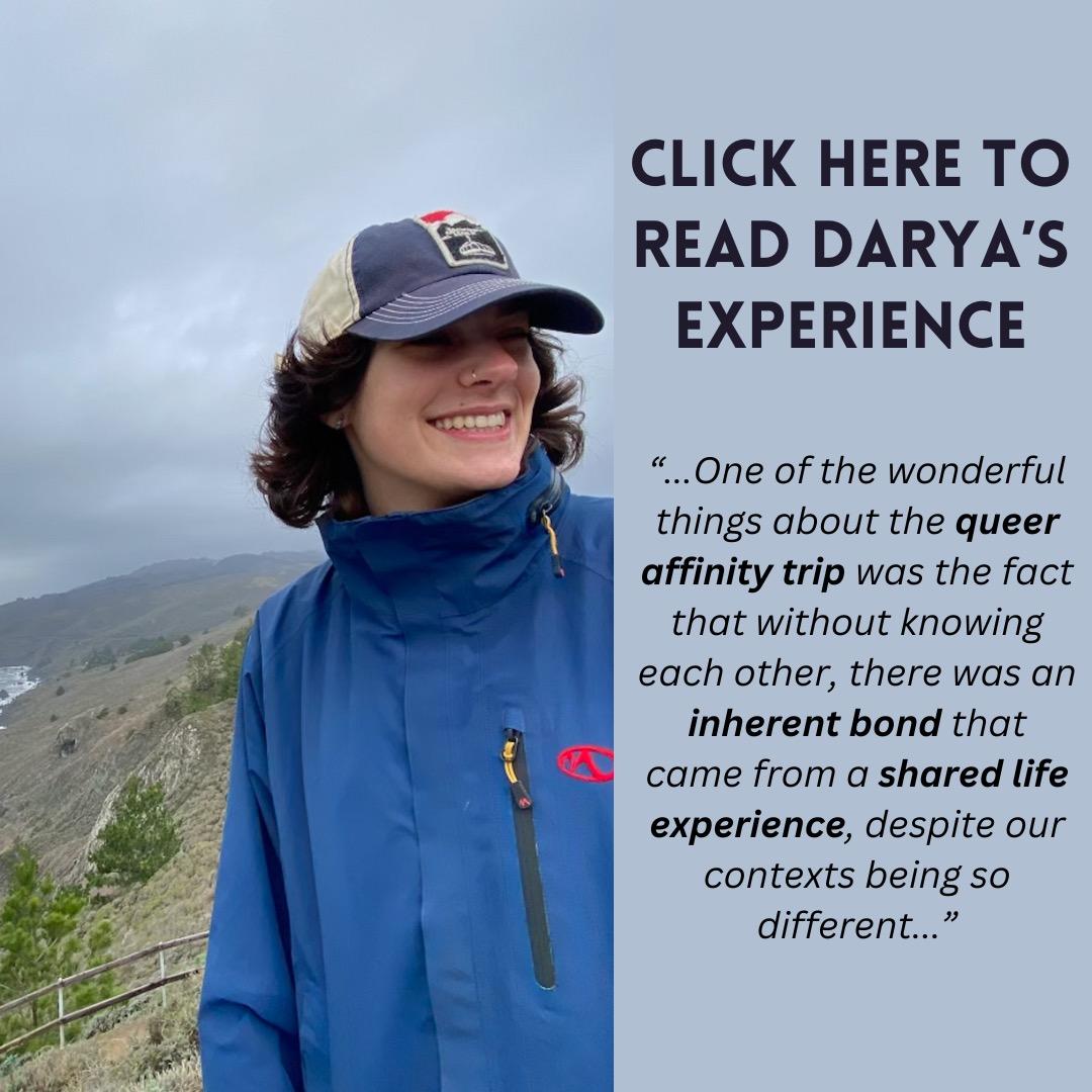 Image of TWO Leader Darya next to the ocean with the text, "Click here to read Darya's experience. One of the wonderful things about the queer affinity trip was the fact that without knowing each other, there was an inherent bond that came from a shared life experience despite our contexts being so different."