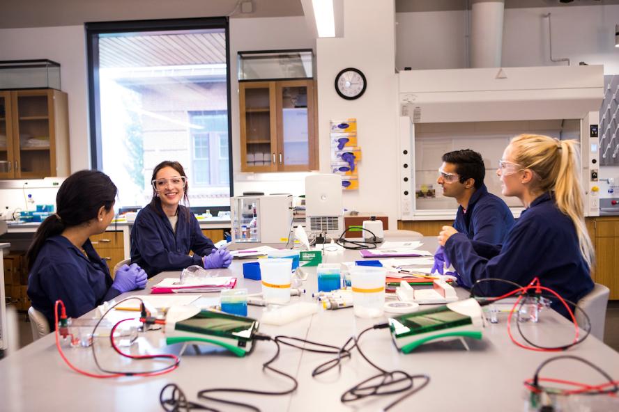 Students conduct biology experiments in a lab in the Science and Engineering Complex on August 7, 2018.