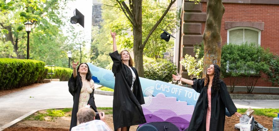  Eylul Akman, A21, Annika Witt, A21, and Samar Shaqour, 21, poses for a photo on Commencement eve with her family near Bendetson Hall