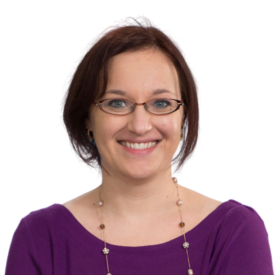 Aliki Karagiannis headshot, wearing purple shirt with long, beaded necklace and glasses