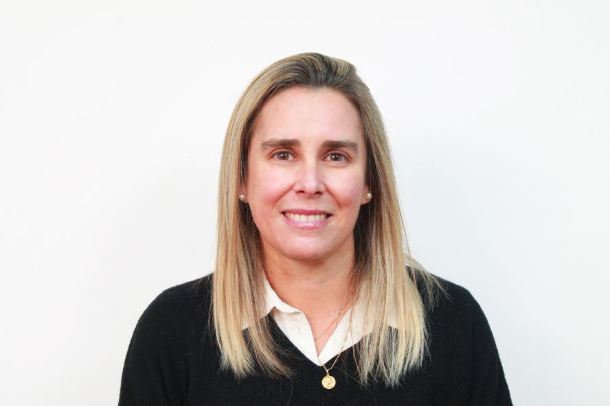 headshot of Tufts in Chile director Loreto Pomar wearing black sweater