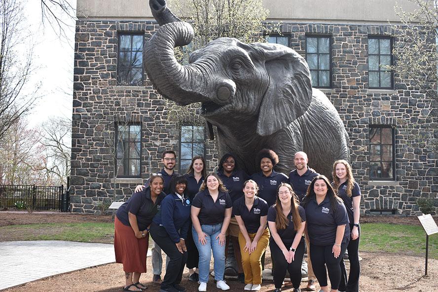 Student pose in front of Jumbo the Elephant statue