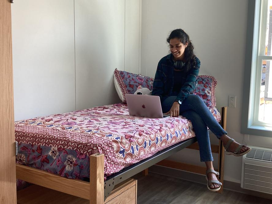 student on computer in double room - the Court at Professors Row