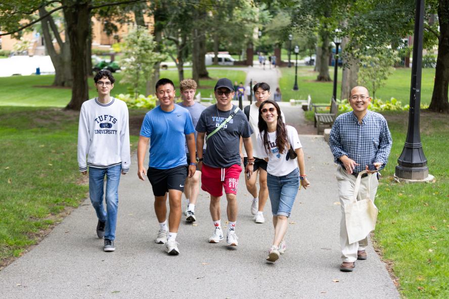 family walking together on Tufts campus