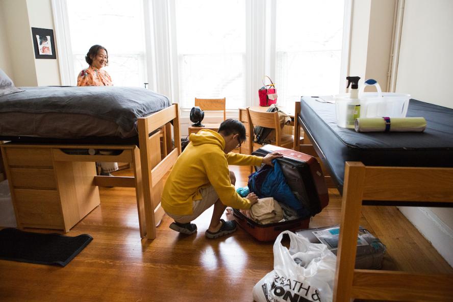 Student unpacking in dorm