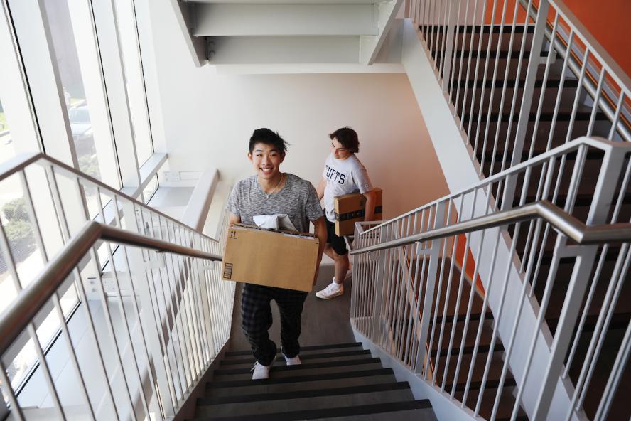 Students moving in with box