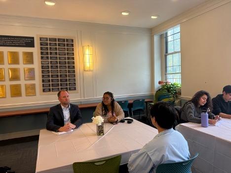 Photo of students sitting with Dean Panzer.