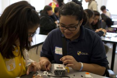two students working on a robotics project
